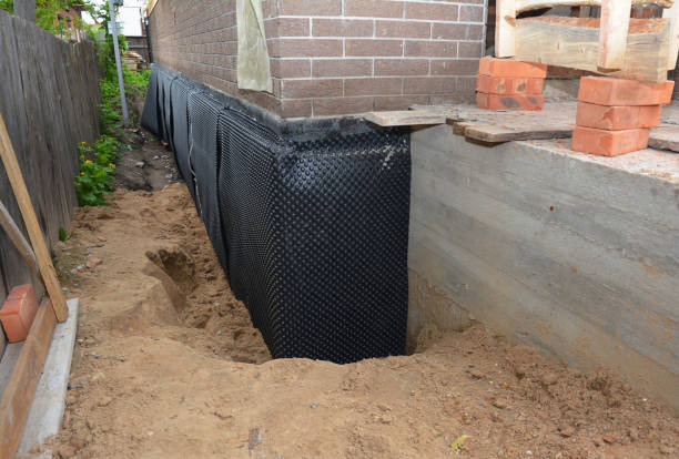 Happy homeowners after waterproofing job in Kintnersville